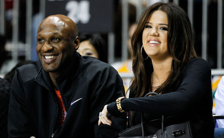 Los Angeles Lakers' Lamar Odom and his wife television personality Khloe Kardashian sit courtside as they attend the 2011 BBVA All-Star Celebrity basketball game as a part of the NBA All-Star basketball weekend in Los Angeles, in this February 18, 2011, file photo. (Reuters)