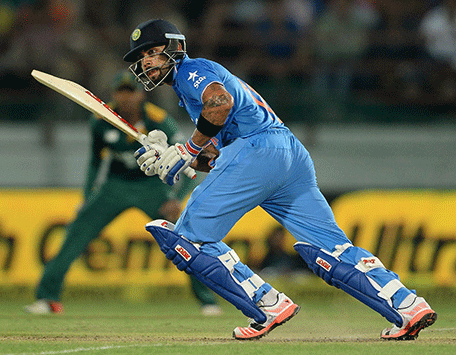 India's batsman Virat Kohli runs during the third one day international (ODI) cricket match between India and South Africa at The Saurashatra Cricket Association Stadium in Rajkot on October 18, 2015.   AFP