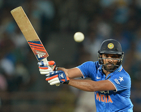 India's batsman Rohit Sharma plays a shot during the third one day international (ODI) cricket match between India and South Africa at The Saurashatra Cricket Association Stadium in Rajkot on October 18, 2015.   AFP