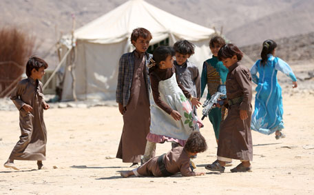 Children play at a camp for internally displaced people who were forced to leave their homes amid fighting between Houthis and pro-government forces, in Yemen's central province of Marib October 18, 2015. (Reuters)