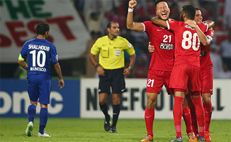 Kwon Kyung-Won (21) of UAE's Al Ahli celebrates at the end of the AFC Champions League semifinal match against Saudi's Al Hilal on October 20, 2015 in Dubai. (AFP)