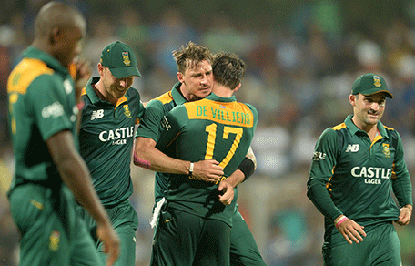 If this file photo, South Africa's Dale Steyn (C) celebrates with captain AB de Villiers and teammates. CSA has announced racial quotas for the team. Pic: AFP