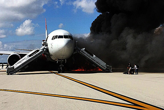 Passengers evacuate from a plane on fire at Fort Lauderdale airport, Florida. (AFP)