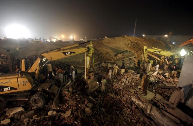 Rescue workers search for survivors after a factory collapsed near the eastern city of Lahore, Pakistan. (Reuters)