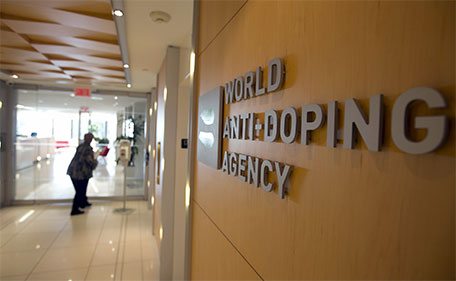 A woman walks into the head office for the World Anti-Doping Agency (WADA) in Montreal, November 9, 2015. (Reuters)