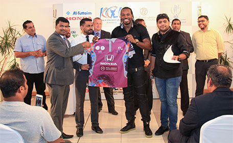 Chris Gayle distributing team jerseys for KCL 2015 at a ceremony on Wednesday in Dubai. (Supplied)