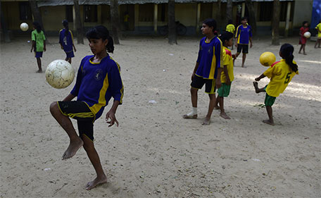 In this photograph taken on October 8, 2015, Bangladeshi primary school footballers practice during a training session in Kolsindur some 200kms north of Dhaka. (AFP)