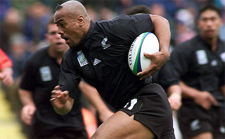 File picture of New Zealand's Jonah Lomu as he tucks the ball under his arm to run and score the All Black's first try against Tonga during their Rugby World Cup Group B match at Ashton Gate in Bristol, England, in this October 3, 1999 file photo. (Reuters)