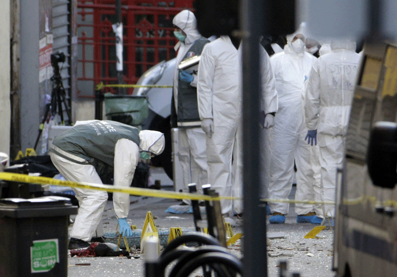 Forensics of French police are at work in the northern Paris suburb of Saint-Denis, on November 18, 2015, after French Police special forces raided an apartment, hunting those behind the attacks that claimed 129 lives in the French capital five days ago. French police said the assault had concluded on an apartment in northern Paris on Wednesday in which at least two jihadists were killed and seven arrested.  (AFP)
