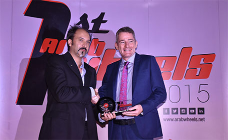 Jonathan Champion, Trading Enterprises Volvo National Sales Manager in the UAE receiving the trophy. (Supplied)