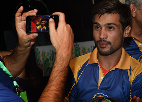 Pakistani cricketer Mohammad Amir poses for a photograph as he attends the drafting of players for the Pakistan Super League (PSL) in Lahore on December 21, 2015. (AFP)