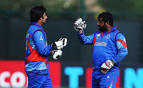 Asghar Stanikai and Shahzad Mohammadi of Afghanistan in action during the ICC World Twenty20 India Qualifier between UAE and Afghanistan at the Grange Cricket Club, on July 10, 2015 in Edinburgh Scotland. (Getty Images)