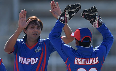 Pakistani paceman Mohammad Asif (left) celebrates after taking a wicket during a domestic one-day match in Hyderabad on January 10, 2016. (AFP)