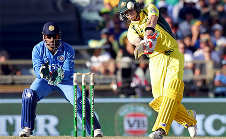 Australia's Steve Smith hits a six as India's wicketkeeper MS Dhoni looks on during the One Day International cricket match in Perth January 12, 2016. (Reuters)