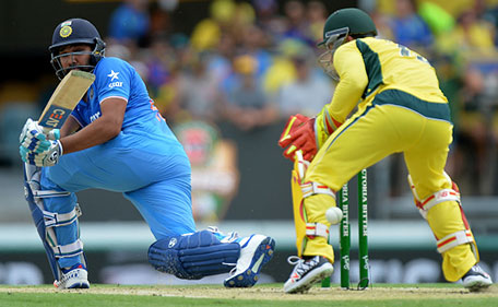 Rohit Sharma of India gets the ball past the keeper during game two of the Victoria Bitter One Day International Series between Australia and India at The Gabba on January 15, 2016 in Brisbane, Australia. (Getty Images)
