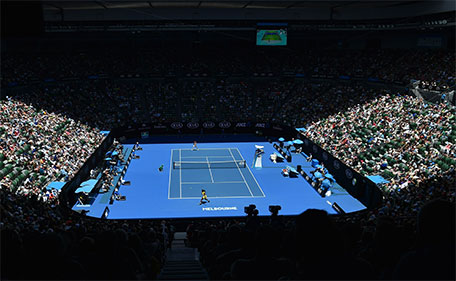 Serena Williams of the US (front) plays a return during her women's singles match against Italy's Camila Giorgi on day one of the 2016 Australian Open tennis tournament in Melbourne on January 18, 2016. (AFP)