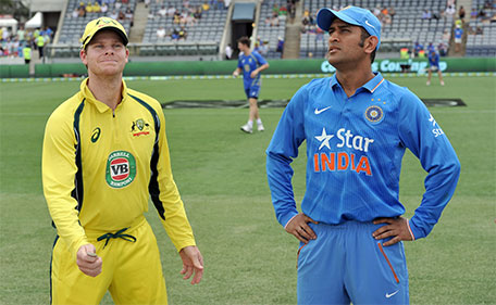 Australia's captain Steve Smith (left)  and Indian captain MS Dhoni toss the coin before starting the fourth one-day international cricket match between India and Australia at the Manuka Oval in Canberra on January 20, 2016. (AFP)