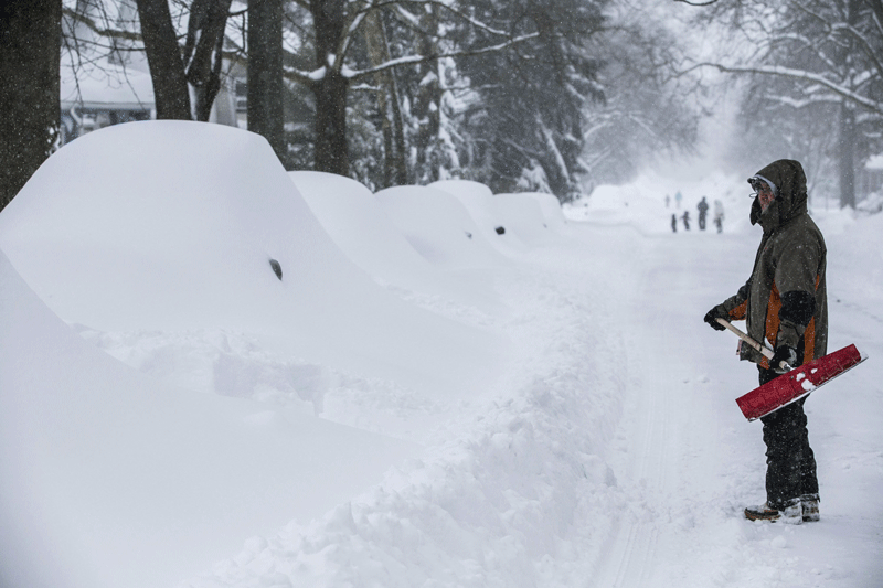 Cars are buried as Camp Hill, Pennsylvannia, residents deal with piles of snow Saturday  January 23, 2016. (AP)