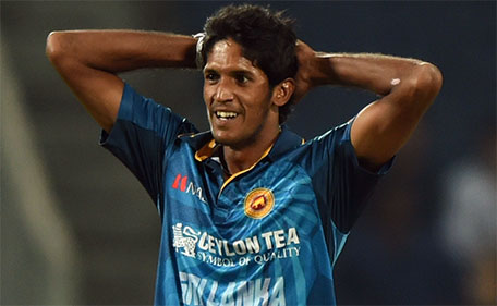 Sri Lanka's Kasun Rajitha reacts after a dropped chance off his bowling during the first T20 international match between India and Sri Lanka at the MCA International Cricket Stadium in Pune on February 9, 2016.  (AFP)