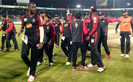 Kevon Cooper of Lahore Qalandars leads the team out after they beat Peshawar Zalmi in Match 15 of the PSL at Sharjah Cricket Stadium on February 13 2016. (@PSL)