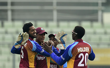 West Indies cricketers celebrate after the dismissal of the Indian cricketer Rishabh Pant during the Under-19 World Cup cricket final between India and West Indies at the Sher-e-Bangla National Cricket Stadium in Dhaka on February 14, 2015. (AFP)