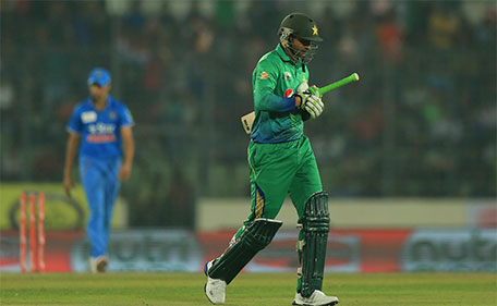 Pakistan cricket player Shoaib Malik  walks off the field after being dismissed during the match between India and Pakistan at the Asia Cup T20 cricket tournament at the Sher-e-Bangla National Cricket Stadium in Dhaka on February 27, 2016. (AFP)