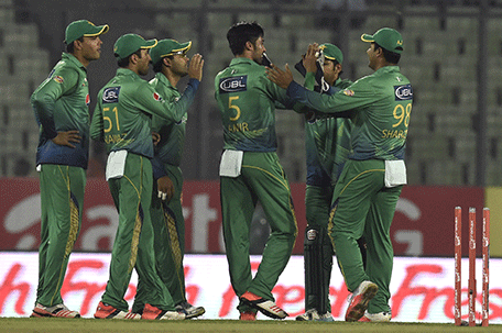 Pakistan cricketers celebrate after the dismissal of the United Arab Emirates cricketer Muhammad Kaleem during the Asia Cup T20 cricket tournament match between Pakistan and United Arab Emirates at the Sher-e-Bangla National Cricket Stadium in Dhaka on February 29, 2016. AFP