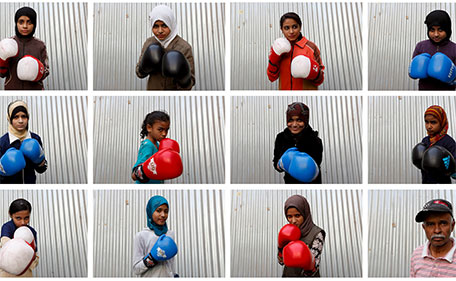 A combination photo shows students of coach Younus Qambrani posing with their boxing gloves at the first women's boxing coaching camp in Pak Shaheen Boxing Club in Karachi, Pakistan, February 20, 2016. (Reuters)