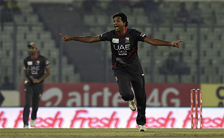 UAE cricket captain Amjad Javed celebrates after the dismissal of the Pakistan cricketer  Mohammad Hafeez during the Asia Cup T20 cricket tournament match between Pakistan and UAE at the Sher-e-Bangla National Cricket Stadium in Dhaka on February 29, 2016. (AFP)