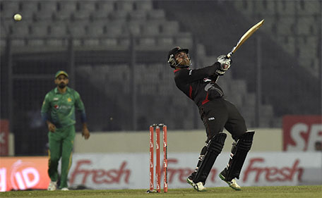 UAE cricketer Shaiman Anwar plays a shot during the Asia Cup T20 cricket tournament match between Pakistan and UAE at the Sher-e-Bangla National Cricket Stadium in Dhaka on February 29, 2016. (AFP)