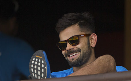 India's Virat Kohli smiles as he rests after a practice session ahead of their match against New Zealand in the ICC World Twenty20 2016 cricket tournament in Nagpur, India, Monday, March 14, 2016. (AP)