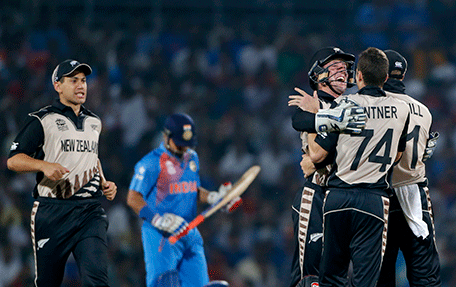 New Zealand players celebrate the wicket of India's Suresh Raina during the ICC World Twenty20 2016 cricket match at the Vidarbha Cricket Association stadium in Nagpur, India, Tuesday, March 15, 2016. (AP)