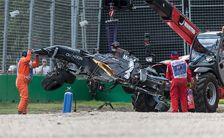 The McLaren of F1 driver Fernando Alonso is retrieved following a crash with Haas F1 driver Esteban Gutierrez at the Australian Formula One Grand Prix in Melbourne, Australia - 20/03/16. (Reuters)