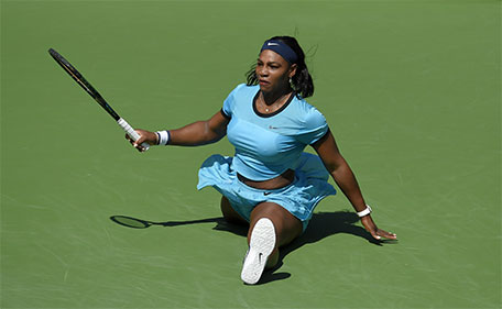 Serena Williams does the splits after returning a shot to Victoria Azarenka in a final at the BNP Paribas Open tennis tournament, Sunday, March 20, 2016, in Indian Wells, Calif. Azarenka won 6-4, 6-4. (AP)
