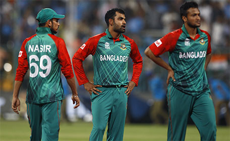 Bangladesh's players (from left) Nasir Hossain, Tamim Iqbal and Shakib Al Hasan react after losing against India in their ICC World Twenty20 2016 cricket match in Bangalore, India, Wednesday, March 23, 2016. (AP)