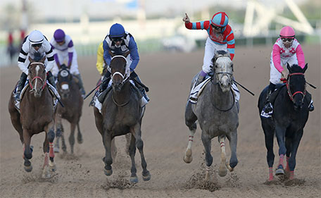 Japanese horse Lani ridden by Yutaka Take (2nd right) crosses the finish line to win the $ 2,000,000 UAE Derby of the Dubai World Cup horse racing at the Meydan Racecourse in Dubai, United Arab Emirates, Saturday, March 26, 2016.  (AP)