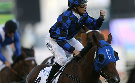 Damian Browne on Australian horse Buffering crosses the finish line to win the $ 1,000,000 Al Quoz Sprint of the Dubai World Cup horse racing at the Meydan Racecourse in Dubai, United Arab Emirates, Saturday, March 26, 2016. (AP)