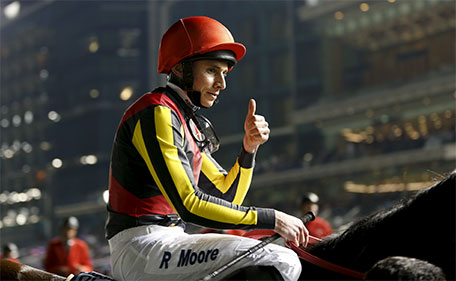 Ryan Moore rides Real Steel from Japan as he celebrates after winning the seventh race Dubai World Cup - Meydan Racecourse, Dubai - 26/3/16. (Reuters)