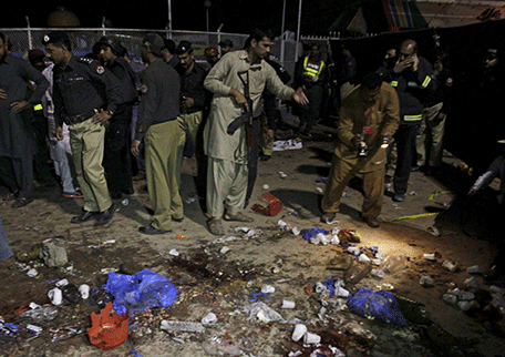 Security officials gather at the site of a blast outside a public park in Lahore, Pakistan, March 27, 2016.   REUTERS