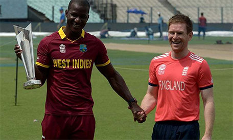 West Indies captain Darren Sammy (left) and England captain Eoin Morgan pose with the World T20 trophy. (AFP)