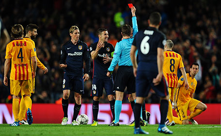 Fernando Torres of Atletico Madrid (9) is shown a red card by referee Felix Brych and is sent off during the UEFA Champions League quarter final first leg match between FC Barcelona and Club Atletico de Madrid at Camp Nou on April 5, 2016 in Barcelona, Spain. (Getty Images)