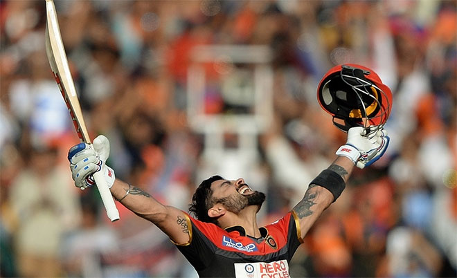 Virat Kohli of Royal Challengers Bangalore is ecstatic after completing his maiden T20 century in the IPL match against Gujarat Lions. (AFP)