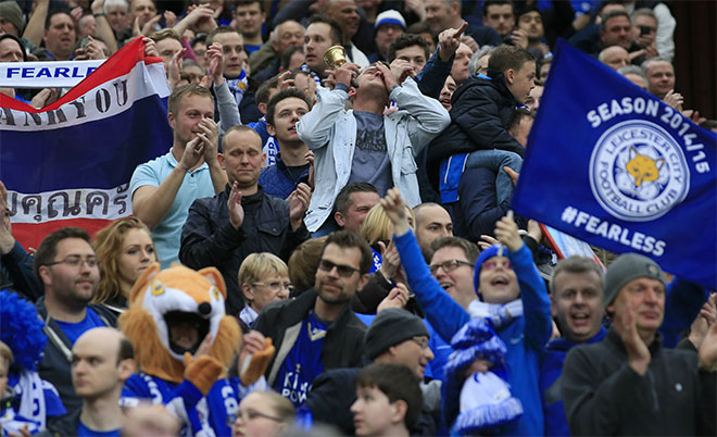 Leicester supporters celebrate after their 1-1 draw in the English Premier League soccer match between Manchester United and Leicester at Old Trafford Stadium, Manchester, England, Sunday, May 1, 2016. (AP)