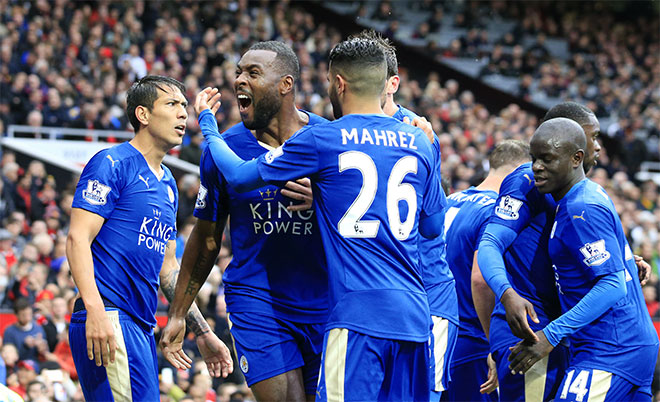 Leicester's Wes Morgan (second left) celebrates with teammates after scoring during the English Premier League soccer match between Manchester United and Leicester at Old Trafford Stadium, Manchester, England, Sunday, May 1, 2016. (AP)