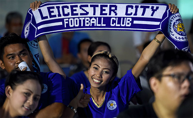 A Leicester City football woman supporter react on May 1, 2016 in Bangkok, as she watches a live broadcast of the English Premier League football match between Manchester United and Leicester City played at Old Trafford in Manchester. (AFP)