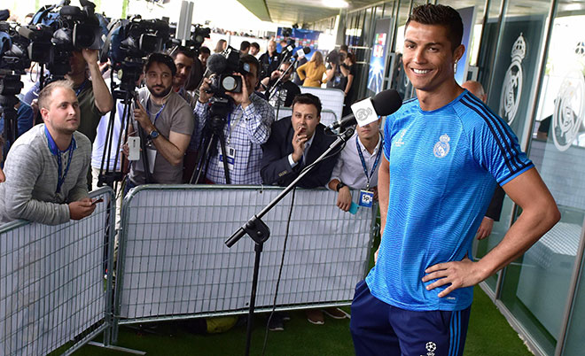 Real Madrid's Portuguese forward Cristiano Ronaldo smiles as he addresses journalists during the club's Open Media Day at Real Madrid sport city in Madrid on May 24, 2016. (AFP)