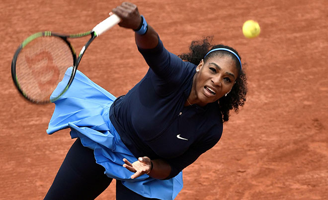 US Serena Williams serves the ball to Slovakia's Magdalena Rybarikova during their women's first round match at the Roland Garros 2016 French Tennis Open in Paris on May 24, 2016. (AFP)