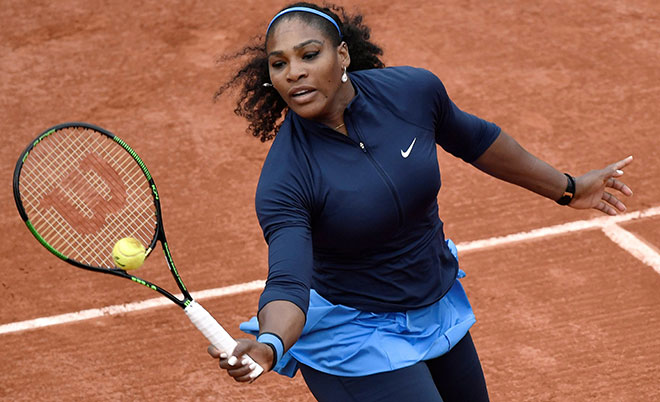US Serena Williams returns the ball to Slovakia's Magdalena Rybarikova during their women's first round match at the Roland Garros 2016 French Tennis Open in Paris on May 24, 2016. (AFP)