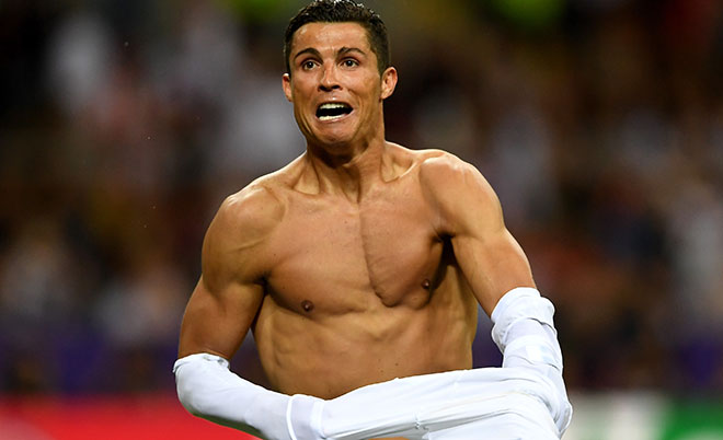 Cristiano Ronaldo of Real Madrid takes off his shirt in celebration after scoring the winning penalty in the penalty shoot out during the UEFA Champions League Final match between Real Madrid and Club Atletico de Madrid at Stadio Giuseppe Meazza on May 28, 2016 in Milan, Italy. (Getty Images)