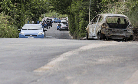 The burned car belonging to slain 22-year-old student Sara Di Pietrantonio is seen along a street in the outskirts of Rome, Monday, May 30, 2016. According to Italian police, Sara, who's body was found close to the car, has been burned alive by her ex-boyfriend as she was was trying to escape from him. (AP)